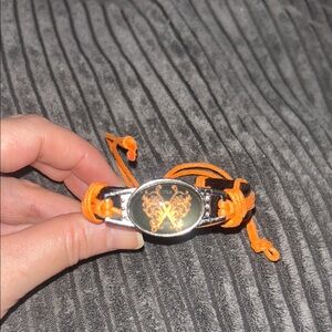 Black and Orange Bracelet with Gold Emblem